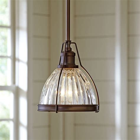 Crafted from opaque white glass, this pendant's spherical shape is suspended from the ceiling by a cord, while the iron. . Birch lane pendant lights